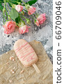 ice cream pops cake on gray background along with flowers. Selective focus, copy space 66709046