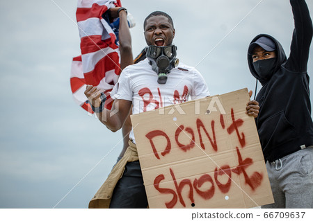 black protestors in america with banners, they complain about the police black protestors in america with banners, they complain about the police 66709637