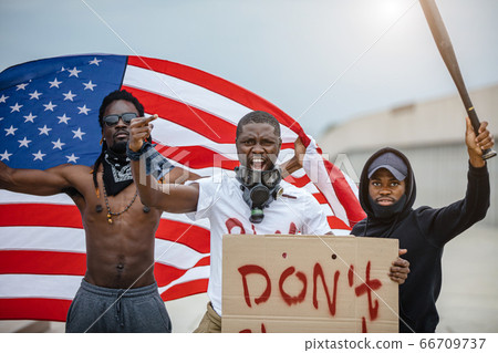 black protestors in america with banners, they complain about the police 66709737