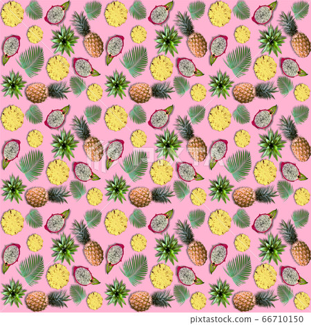 Exotic fruits and tropical palm leaves on pink Exotic fruits and tropical palm leaves on pink 66710150