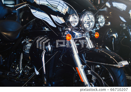 Image of a new motorcycle in a store. 66710207