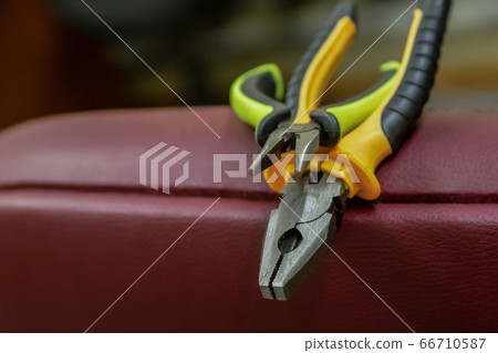 pair of pliers with yellow black handles plumbing 66710587