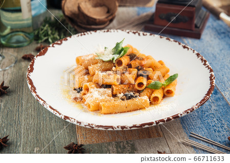 Rigatoni pasta putanesca with olives anchovies 66711633