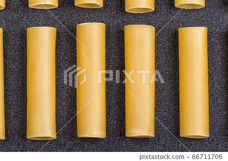 Few cannelloni on grey background close up. Pasta Few cannelloni on grey background close up. Pasta 66711706