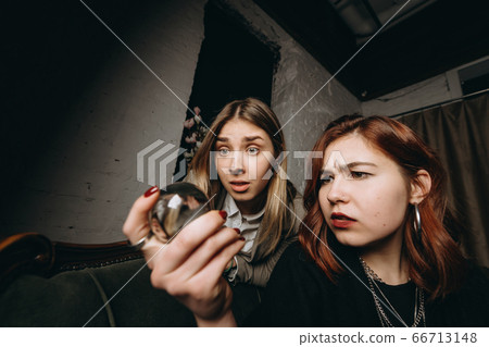 Woman and woman fortune teller with crystal ball Woman and woman fortune teller with crystal ball 66713148
