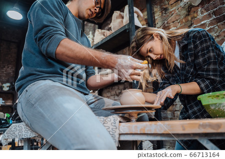 Making a handmade clay pot. Pottery lesson, hobby. Making a handmade clay pot. Pottery lesson, hobby. 66713164