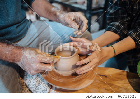 Making a handmade clay pot. Pottery lesson, hobby. 66713523