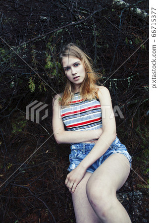 young pretty tourist girl with backpack in forest, travel lifestyle people concept young pretty tourist girl with backpack in forest, travel lifestyle people concept 66715377