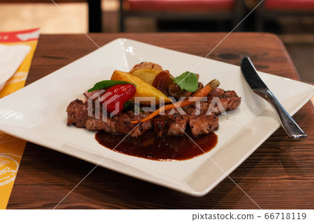roasted beef steak on white plate roasted beef steak on white plate 66718119