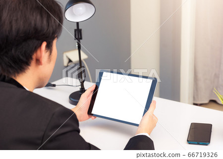 Back view of Businessman video conference by 66719326