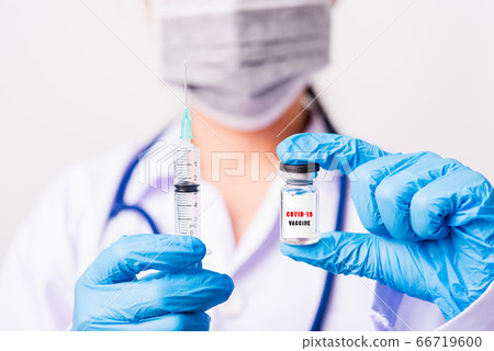 woman doctor wearing face mask protective in lab 66719600