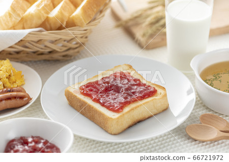 Bread on the table (strawberry jam) 66721972