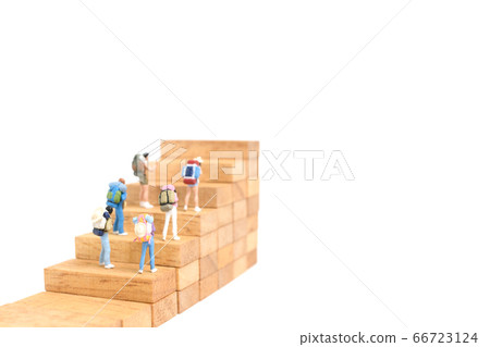 Miniature people up on wooden stair Miniature people up on wooden stair 66723124