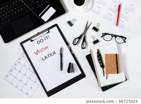 Poster with motivation words to work on office business desk top view	 66725028