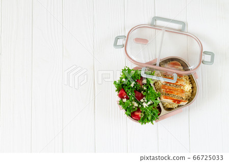 Lunchbox with balanced food on wooden table top view with space for text Lunchbox with balanced food on wooden table top view with space for text 66725033