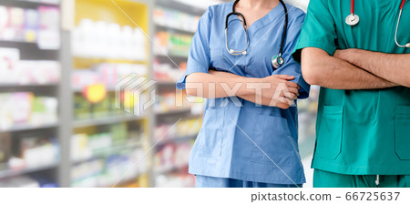 Doctor and surgeon with arms crossed in hospital. 66725637