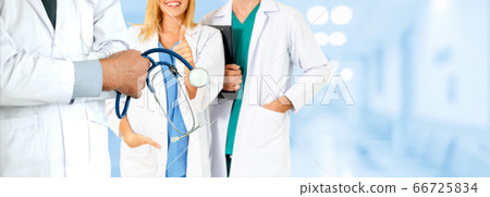 Doctor working in hospital with other doctors. 66725834