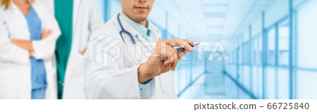 Doctor working in hospital with other doctors. 66725840