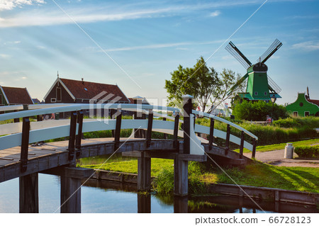 Bridge over canal at windmills at Zaanse Schans in Holland. Zaandam, Netherlands 66728123