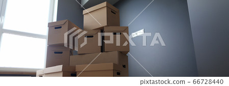 Lot of cardboard boxes on wooden floor new flat closeup 66728440
