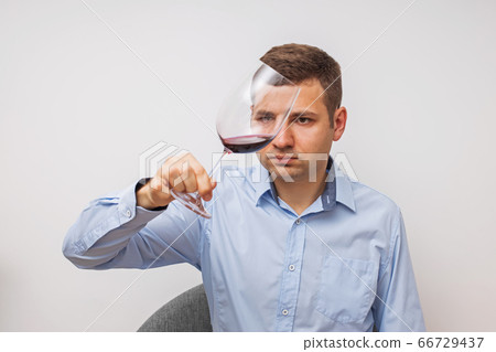 Silhouette of man degusting wine. Isolated on white Silhouette of man degusting wine. Isolated on white 66729437