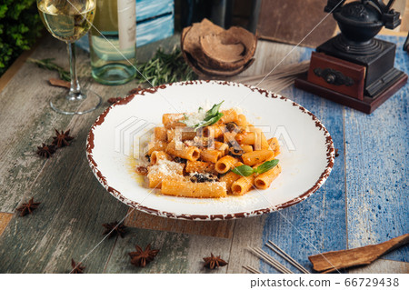 Rigatoni pasta putanesca with olives anchovies 66729438