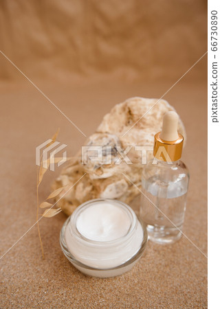 Caring cosmetics in an oyster shell on the sand. Eco-friendly organic cosmetics. 66730890