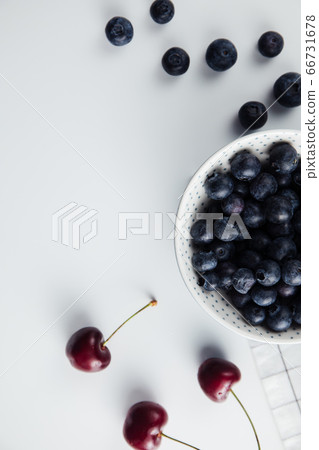 Close-up of cherries and blueberries on a wooden Board. Fresh berries 66731678