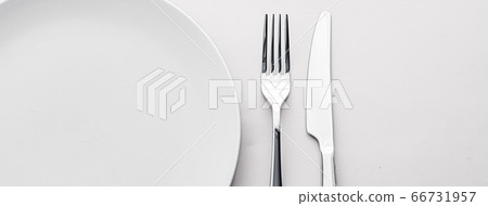 Empty plate and cutlery as mockup set on white background, top tableware for chef table decor and menu branding Empty plate and cutlery as mockup set on white background, top tableware for chef table decor and menu branding 66731957