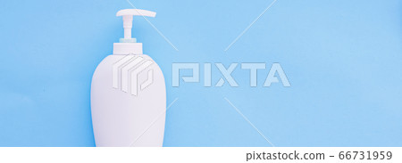 Blank label cosmetic container bottle as product mockup on blue background Blank label cosmetic container bottle as product mockup on blue background 66731959