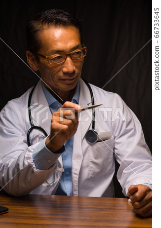 Doctor Middle-aged doctor Middle-aged doctor Doctor with a straight face in a black back Doctor Middle-aged doctor Middle-aged doctor Doctor with a straight face in a black back 66733645