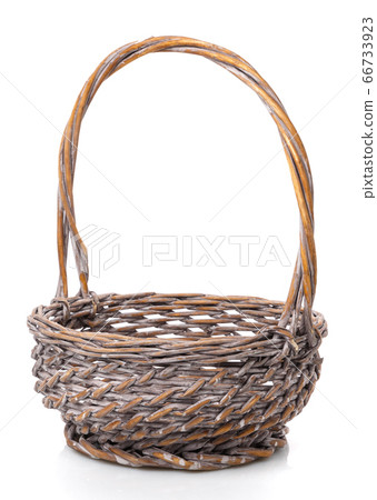 Dark brown round wicker basket with high handle. Isolated. Handmade. Dark brown round wicker basket with high handle. Isolated. Handmade. 66733923