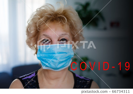 Cropped image of female physician wearing medical mask Cropped image of female physician wearing medical mask 66734311