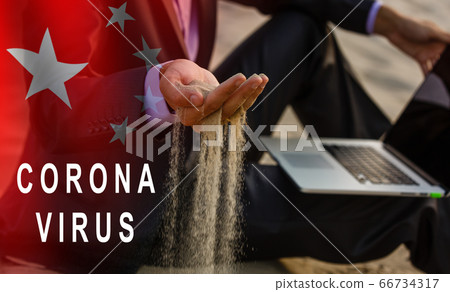 Concept of coronavirus quarantine. sand flows between the fingers of a man Concept of coronavirus quarantine. sand flows between the fingers of a man 66734317