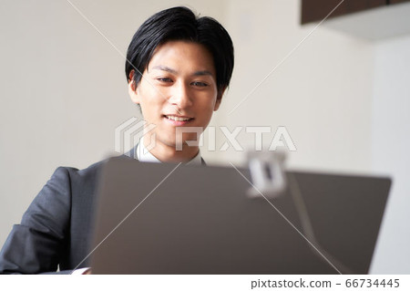 Man in a suit making a video call 66734445