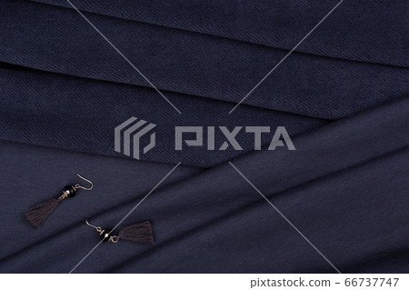 Moscow, Russia - 05/18/2020: Sewing fabric with elements of decor for dress, skirts, jacket, option for sale in the online store, catalog option 66737747