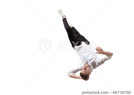 Mid-air beauty. Full length studio shot of attractive young man hovering in air and keeping eyes closed 66738700