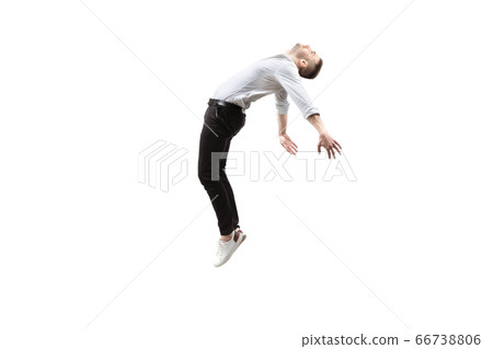 Mid-air beauty. Full length studio shot of attractive young man hovering in air and keeping eyes closed 66738806