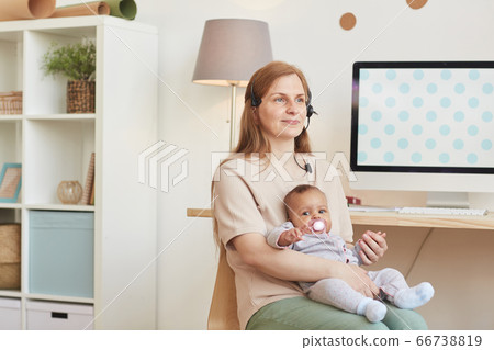 Working Mother Holding Baby 66738819