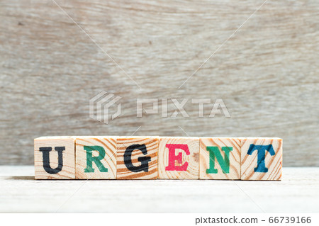 Alphabet letter block in word urgent on wood background 66739166
