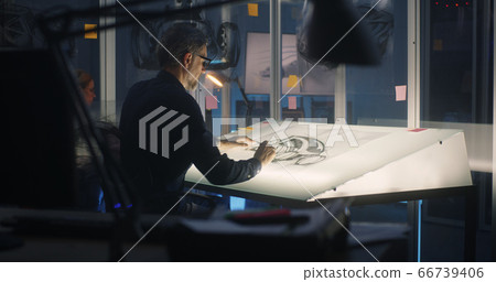 Car designer working on concept art Car designer working on concept art 66739406