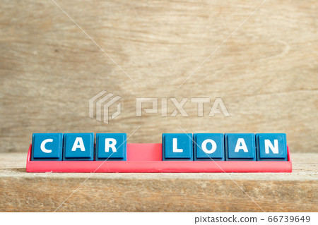 Tile letter on red rack in word car loan on wood background Tile letter on red rack in word car loan on wood background 66739649
