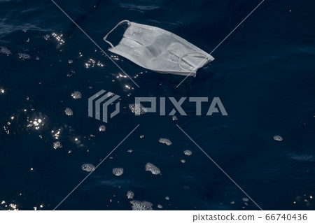 covid mask abandoned on sea water covid mask abandoned on sea water 66740436