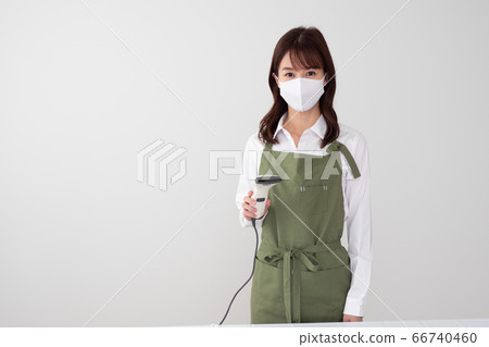 Woman making cashless payment 66740460