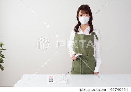 Woman making cashless payment 66740464