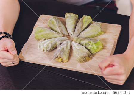 cabbage stuffed with rice and meat on plate. 66741362
