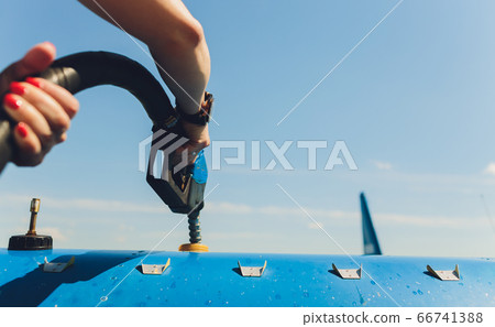 Refuel the small plain in close up. Refuel the small plain in close up. 66741388