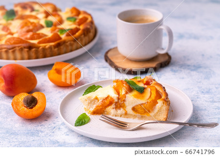 Apricot mascarpone tart, on blue background. 66741796