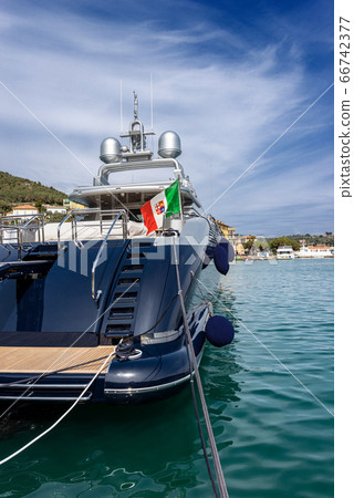 Blue and silver motor yacht in the port of Portovenere Liguria Italy 66742377