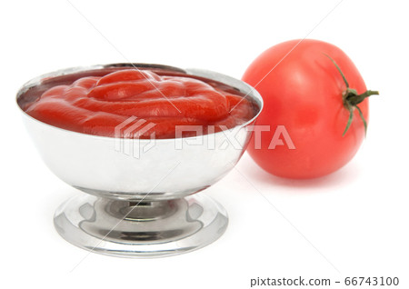 Ketchup sauce in metal bowl and tomato Ketchup sauce in metal bowl and tomato 66743100